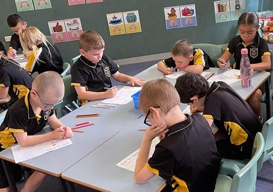 Students learning at desks
